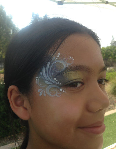 Festival Lady with Painted Swirls near her eye.